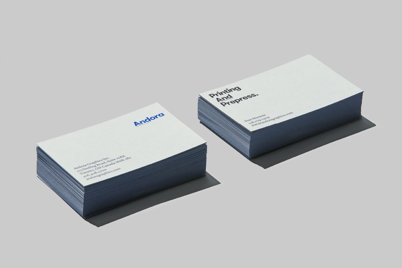 Pile of Andora business cards